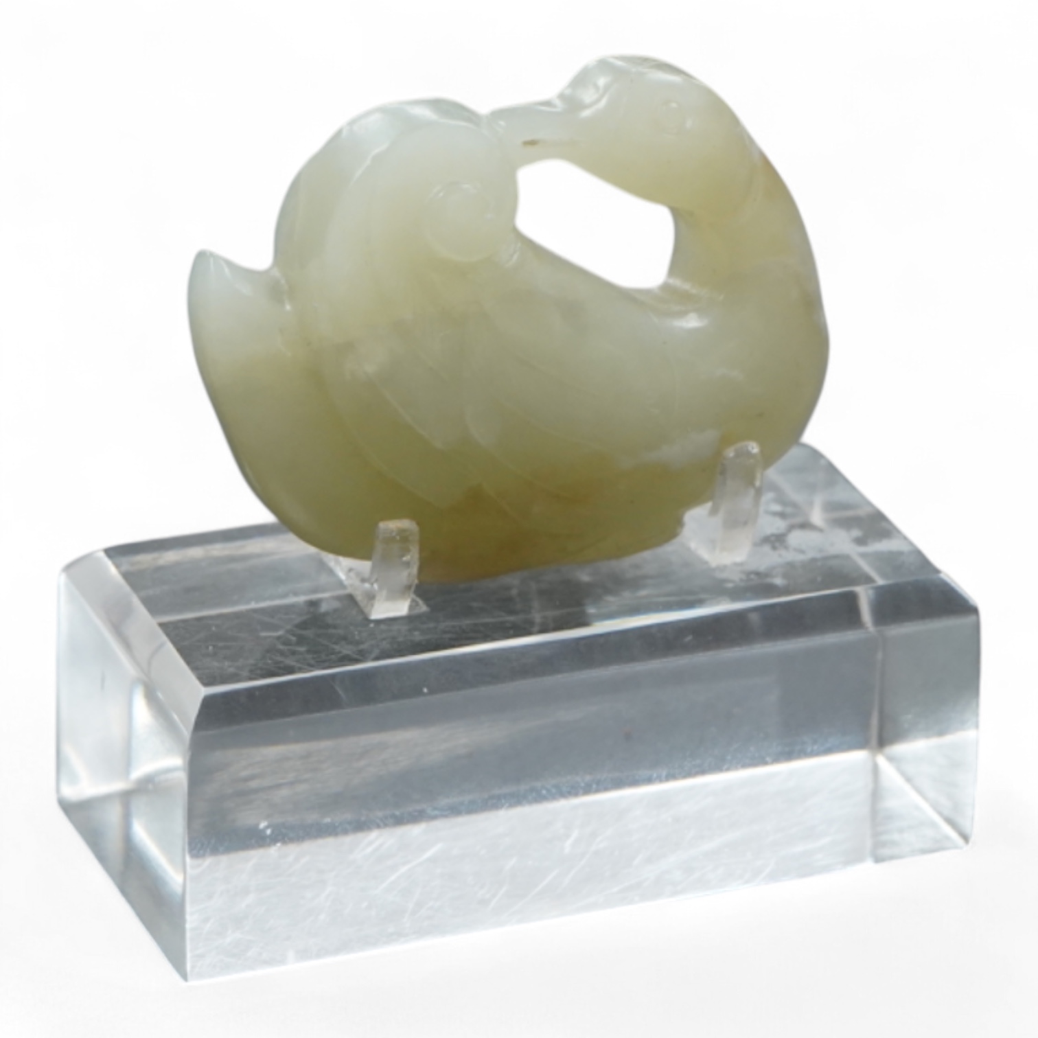 A Chinese celadon jade carving of a duck, Qing, with perspex stand, 5cm wide